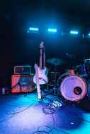 photo of electric guitar and drum set